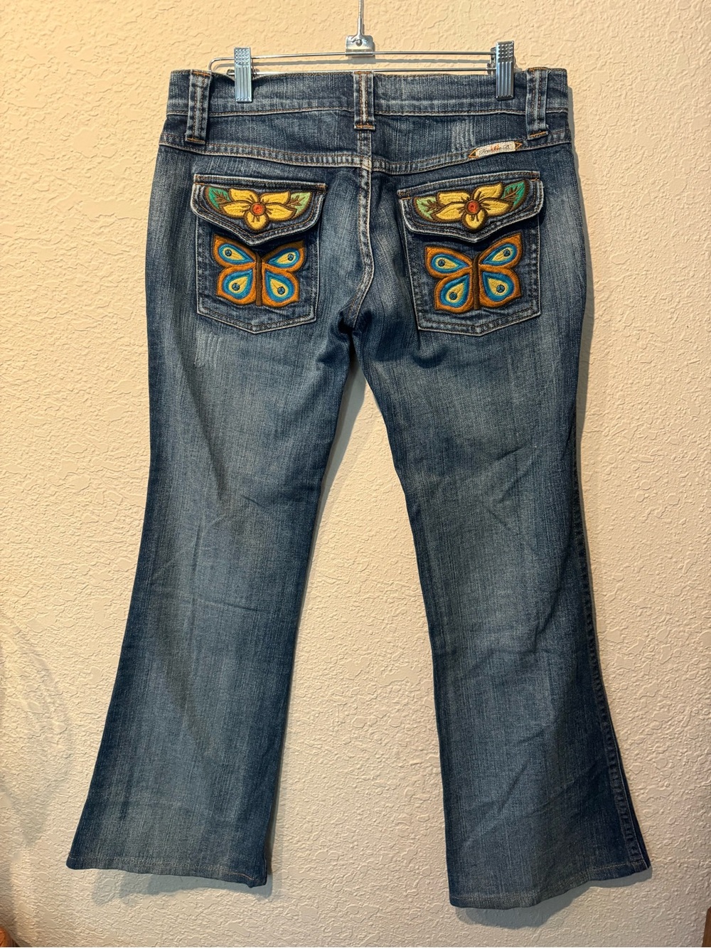 Frankie B. Blue Denim Flared Jeans with Colorful Embroidered Butterfly Pockets
